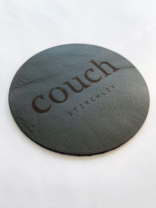 engraved leather coaster made for a bar in Birmingham. Lasered onto dark green leather