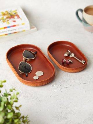 Luxury tan leather trinket trays in two sizes, designed for stylish storage of everyday essentials. A thoughtful and practical gift for any occasion