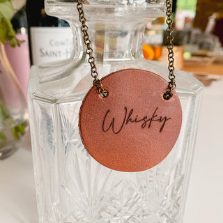 Script laser leather bottle tag in cognac