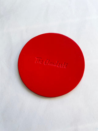 Chilli red leather coaster with client logo debossed made for a restaurant in Chelsea.