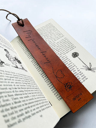 My forever honey engraved onto a tan bookmark with a bee motif..