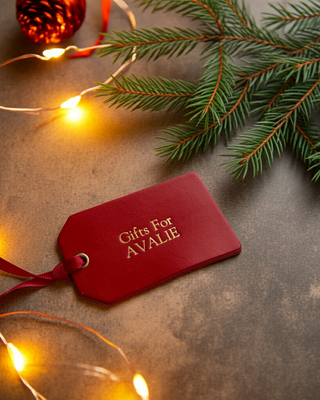 Gifts for Avalie written in gold on a red leather stocking label.