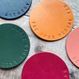 Hand stamped hand painted leather coasters available in navy, olive, terracotta, raspberry and sunshine yellow. All made to order.