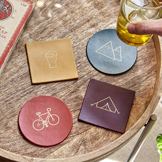 Leather coasters with hobby pictures applied on in gold. Available in circle or square shape.